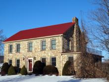 Red Metal Roof Replacement on 2-Story Stone House 001