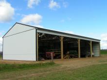 40x80x16 farm implement shed with four open bays